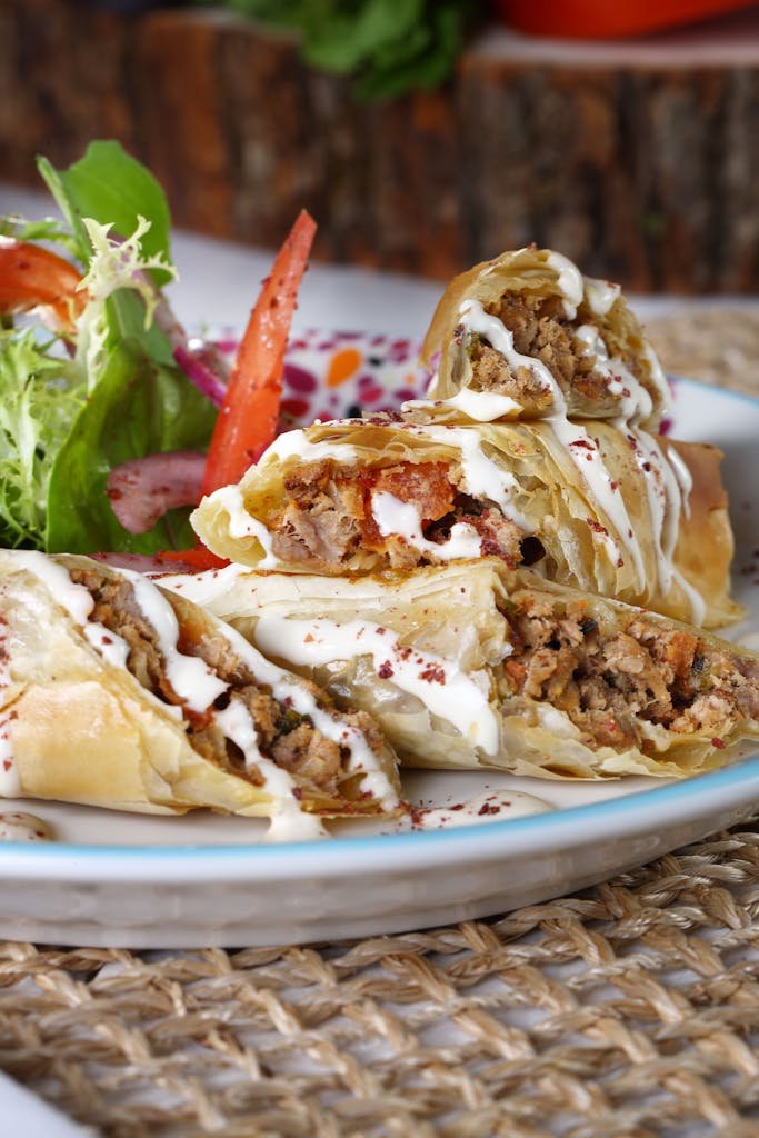Appetizing Turkish börek with salad, perfect for a savory meal.