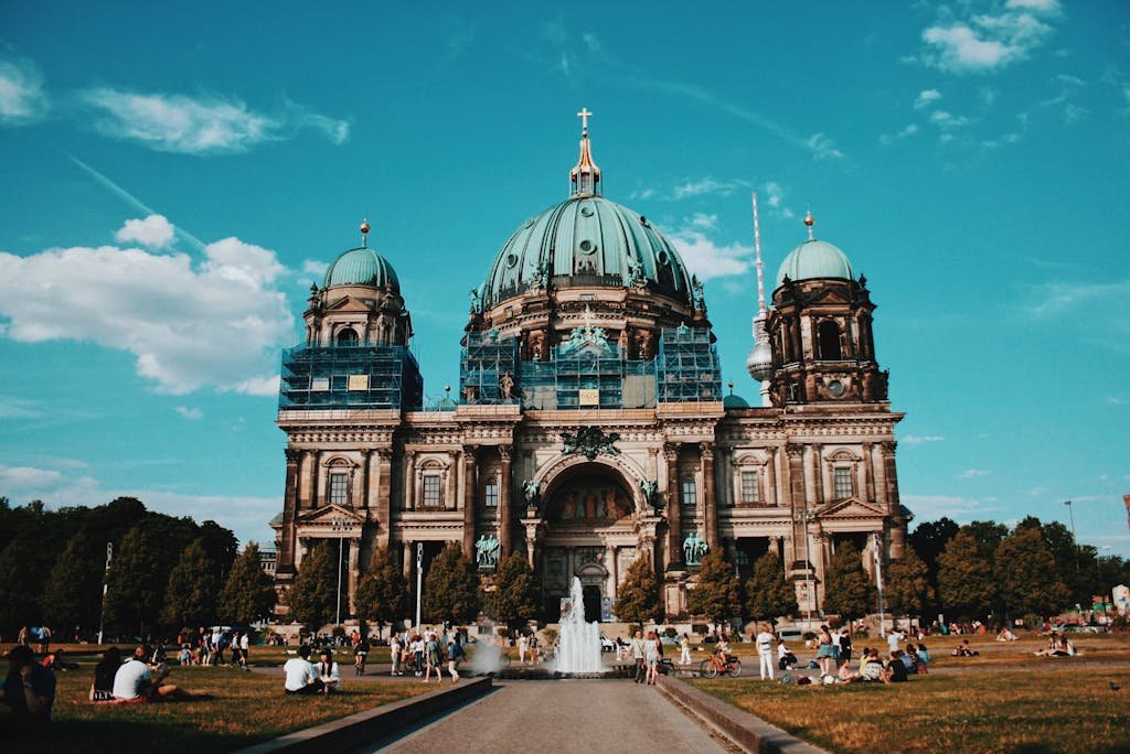 Captivating image of Berlin Cathedral against a vibrant blue sky, showcasing its architectural beauty.