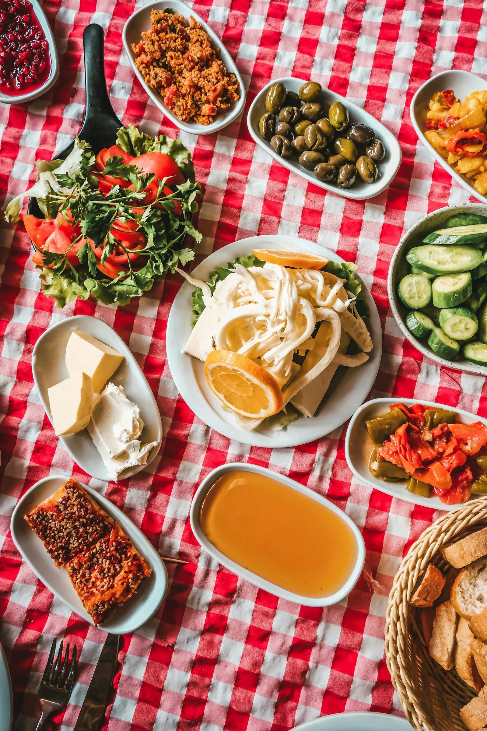 Turkey Travel Guide: Timeless Beauty Across Two Continents 10 Delicious assortment of Turkish meze on a checkered tablecloth, showcasing vibrant colors and textures.