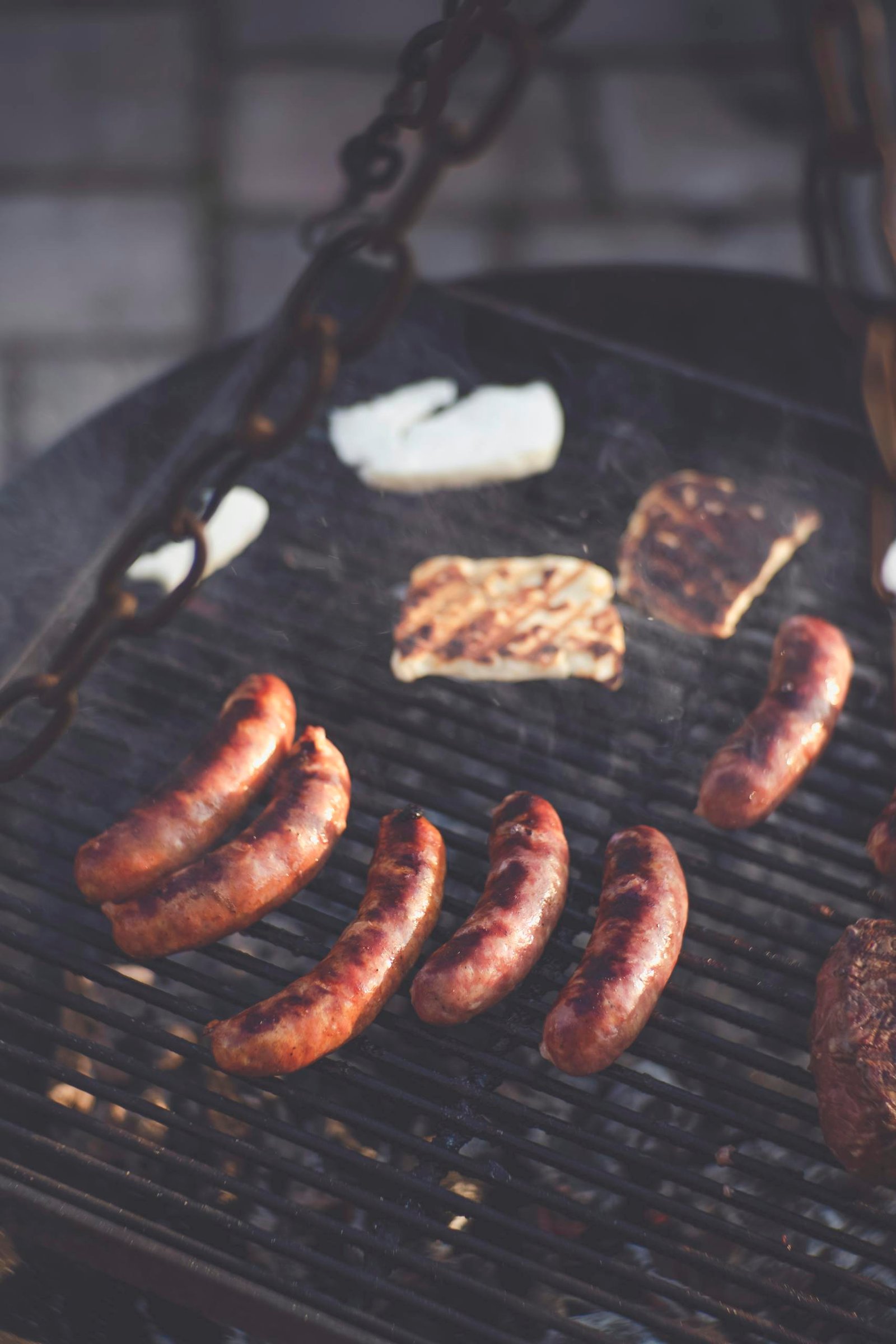 England Travel Guide for first time visitors 9 Delicious sausages and steak grilling over an outdoor barbecue with a smoky, chargrilled finish, perfect for a summer cookout.
