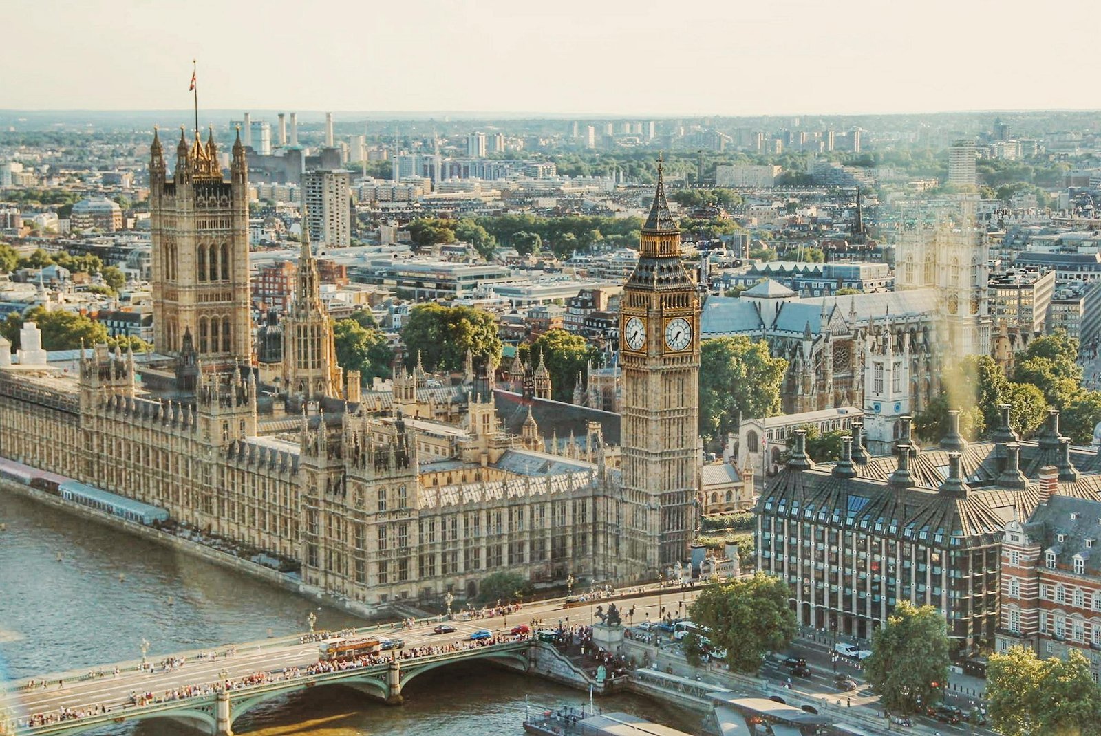 best time to visit London Stunning aerial view of London's iconic Big Ben and the river Thames under daylight.