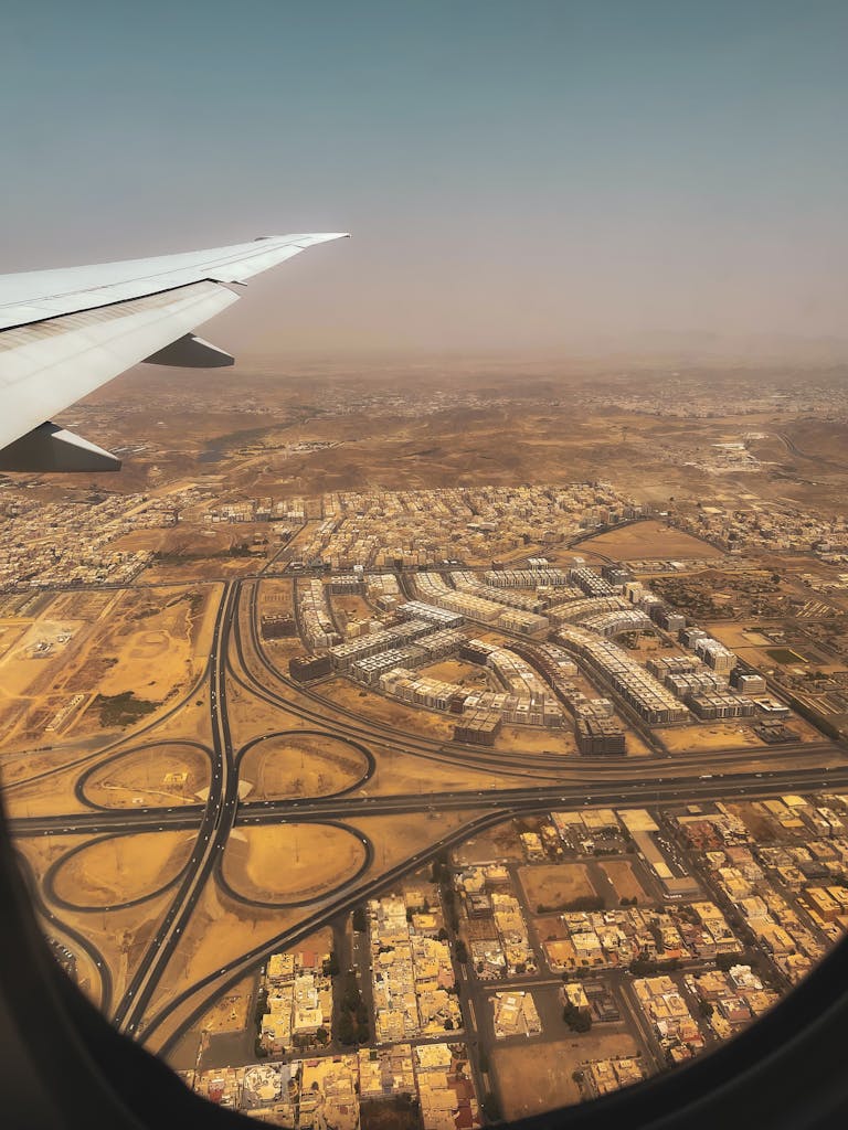 Getting around Saudi Arabia? Transport Tips for Tourists 4 Aerial view of Jeddah, Saudi Arabia showcasing urban planning and desert surroundings.