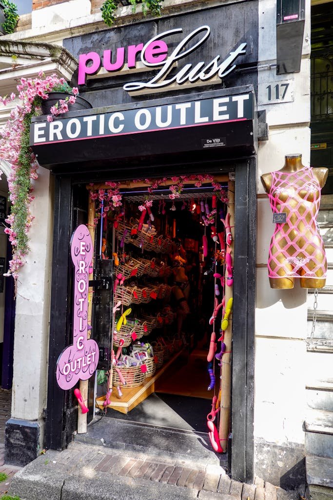 Colorful and inviting entrance to an adult store with playful decorations and vibrant signage.