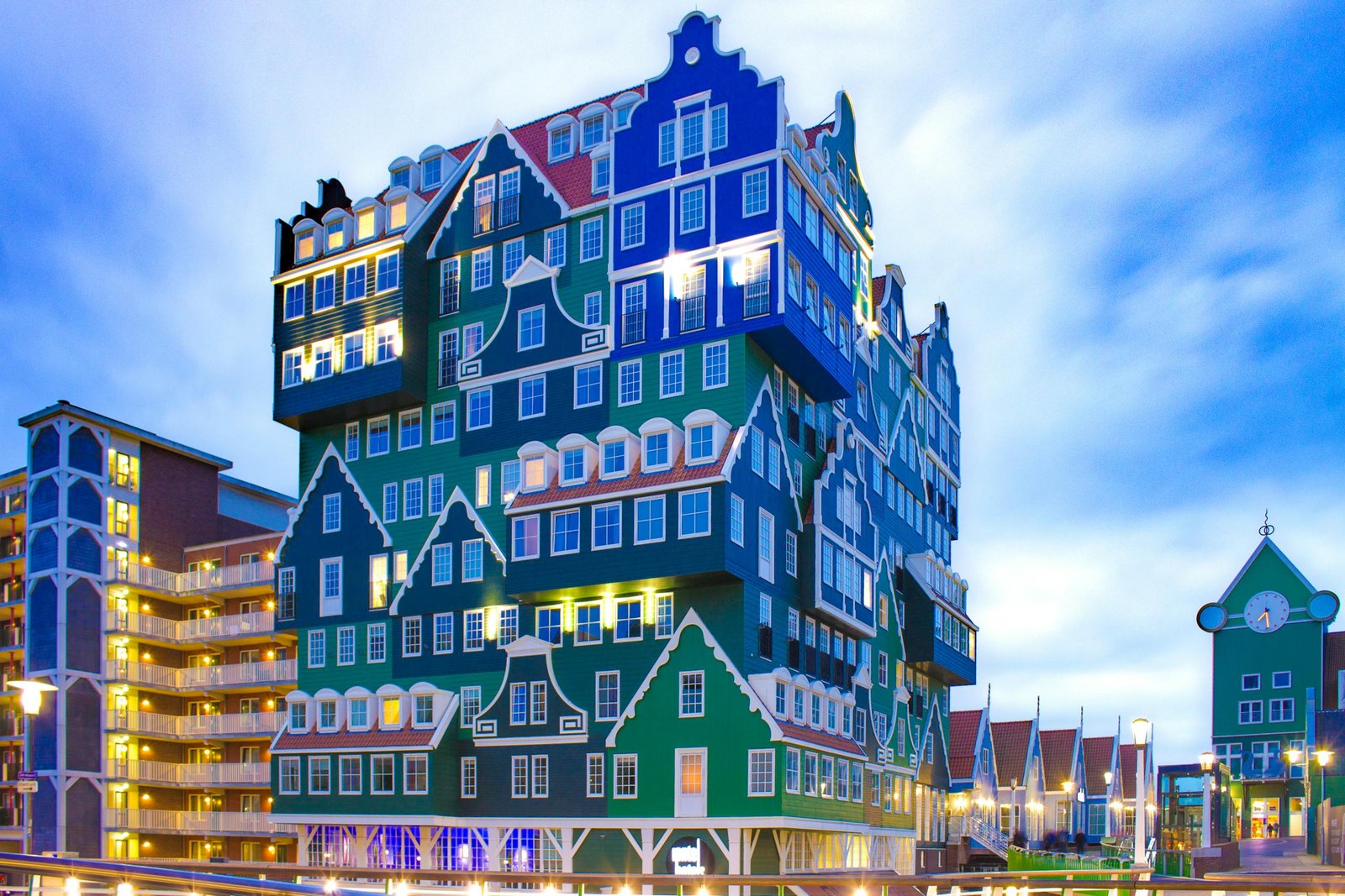 Distinctive stacked building design in Zaandam, Netherlands, during twilight.