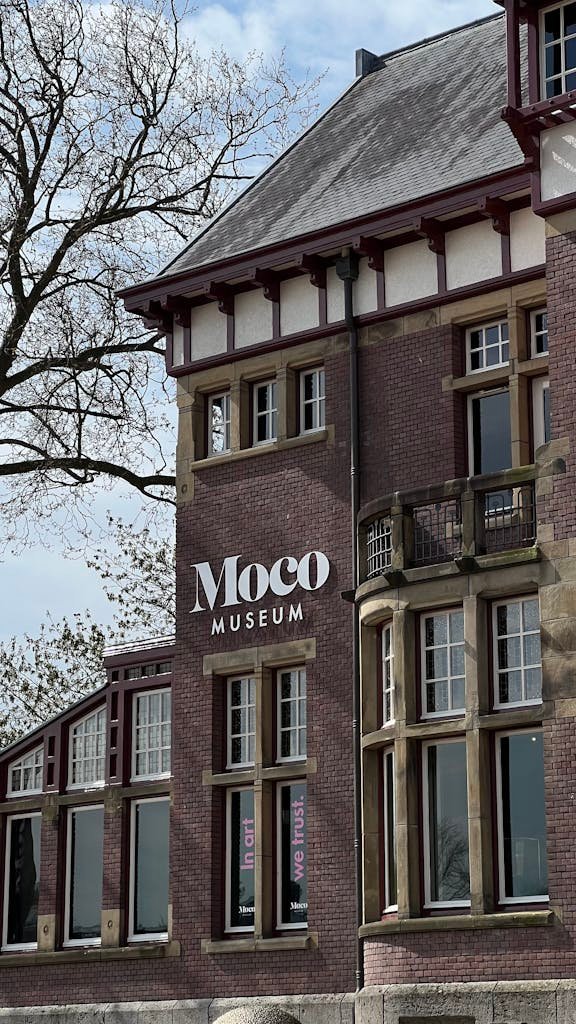 Explore the classic architecture of the Moco Museum in Amsterdam, Netherlands.
