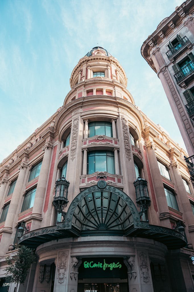 Ornate facade of El Corte Inglés department store in Barcelona, showcasing classic architectural design.