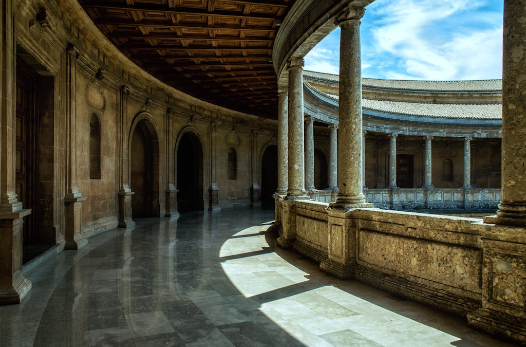 Best Time to Visit Spain: A Complete Guide to Spain's Seasons and Weather 5 Stunning architectural view of Alhambra's courtyard in Spain, showcasing historical design and stone columns.