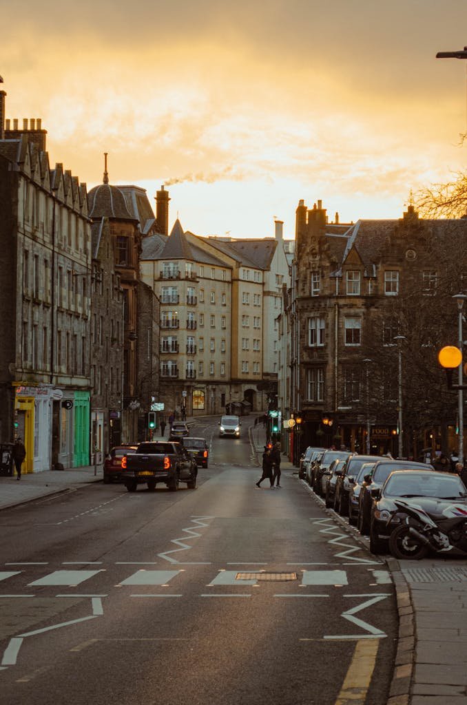 45 Unique Things to Do in Edinburgh: Hidden Spots & Must-See Attractions 35 A picturesque evening scene on Cockburn Street, Edinburgh featuring historic architecture and people walking.
