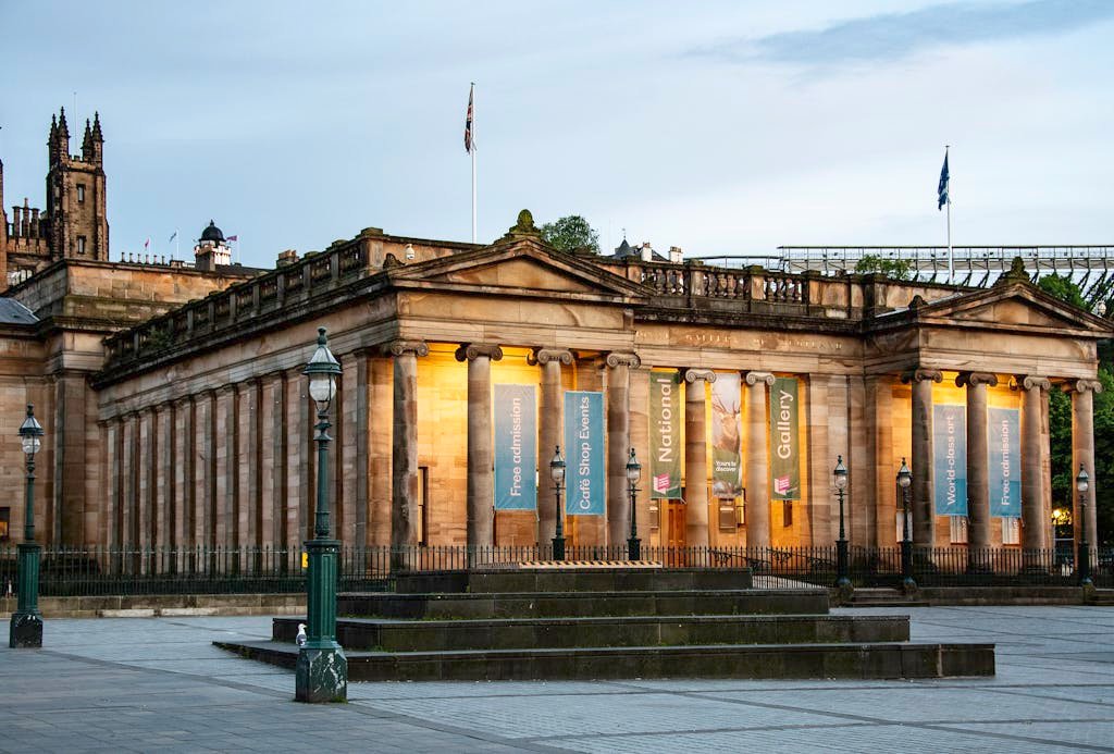 45 Unique Things to Do in Edinburgh: Hidden Spots & Must-See Attractions 28 Beautiful evening view of the Scottish National Gallery in Edinburgh, Scotland showcasing classical architecture.