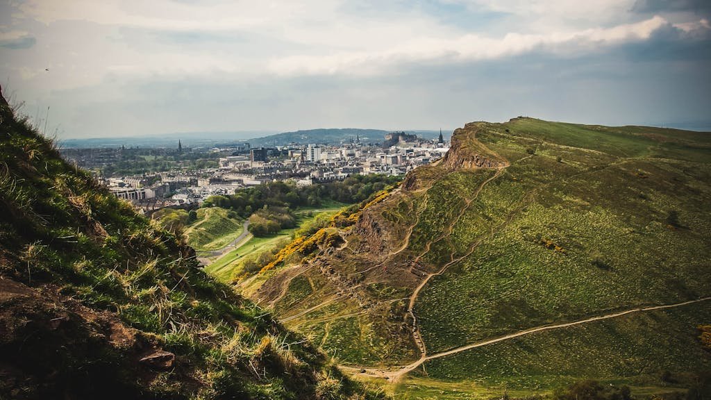 45 Unique Things to Do in Edinburgh: Hidden Spots & Must-See Attractions 2 Breathtaking view of Edinburgh cityscape from Arthur's Seat, one of the unique things to do in Edinburgh