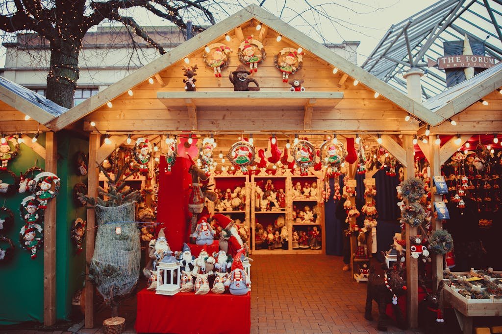 45 Unique Things to Do in Edinburgh: Hidden Spots & Must-See Attractions 36 Charming Christmas market stall filled with decorations and festive cheer.
