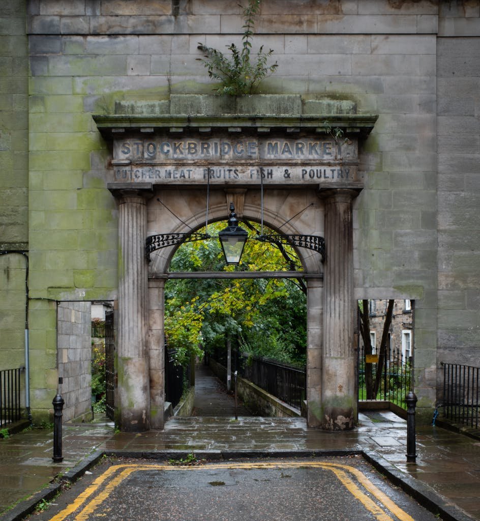 45 Unique Things to Do in Edinburgh: Hidden Spots & Must-See Attractions 19 Rainy day at the Stockbridge Market entrance, Edinburgh.