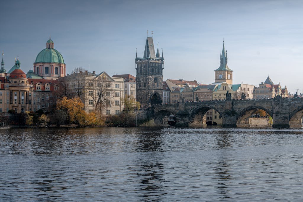 Beautiful view of Charles Bridge and historic Prague architecture against a serene river backdrop during our Prague travel itinerary