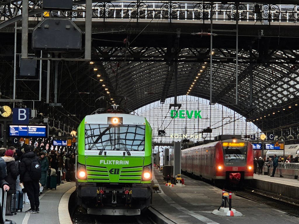Flixtrain and passengers at Cologne Central Station, Germany.