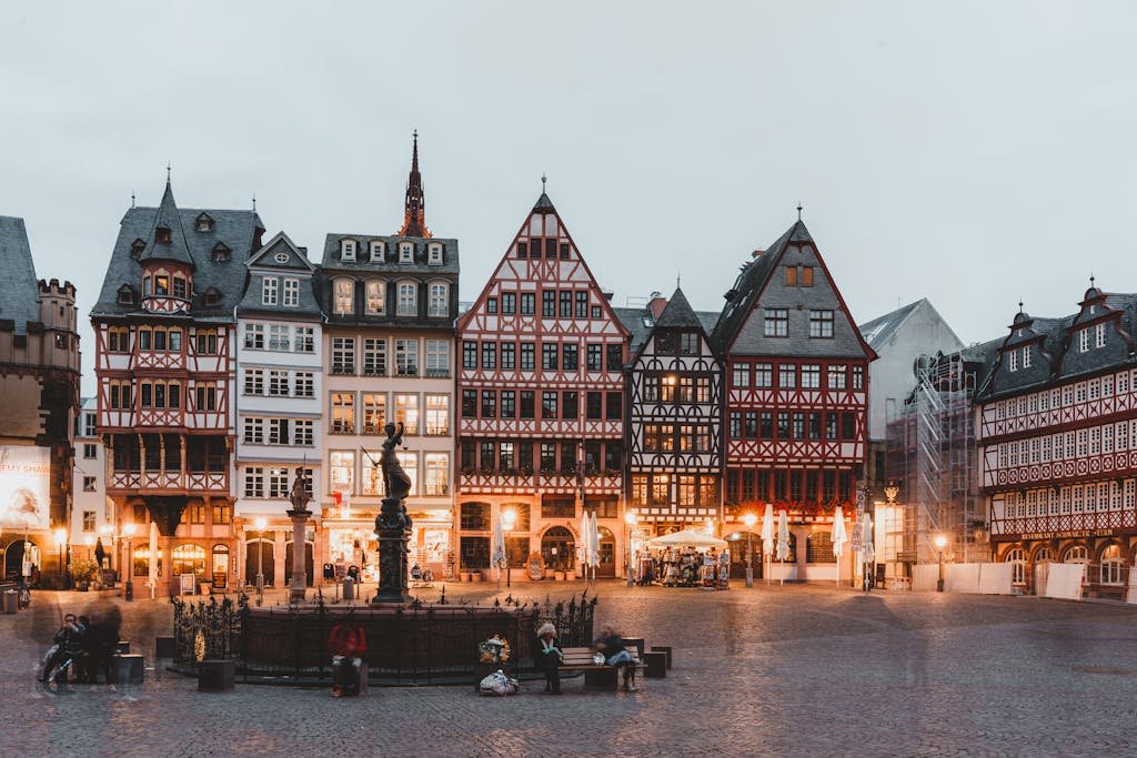 Quaint Römer Square in Frankfurt showcasing traditional half-timbered houses at dusk.
