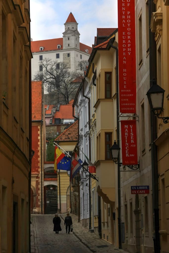 Charming street in Bratislava with a view of the iconic Bratislava Castle in Slovakia.
