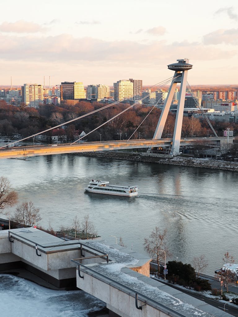Scenic view of Most SNP bridge and Danube river at sunset in Bratislava, Slovakia.