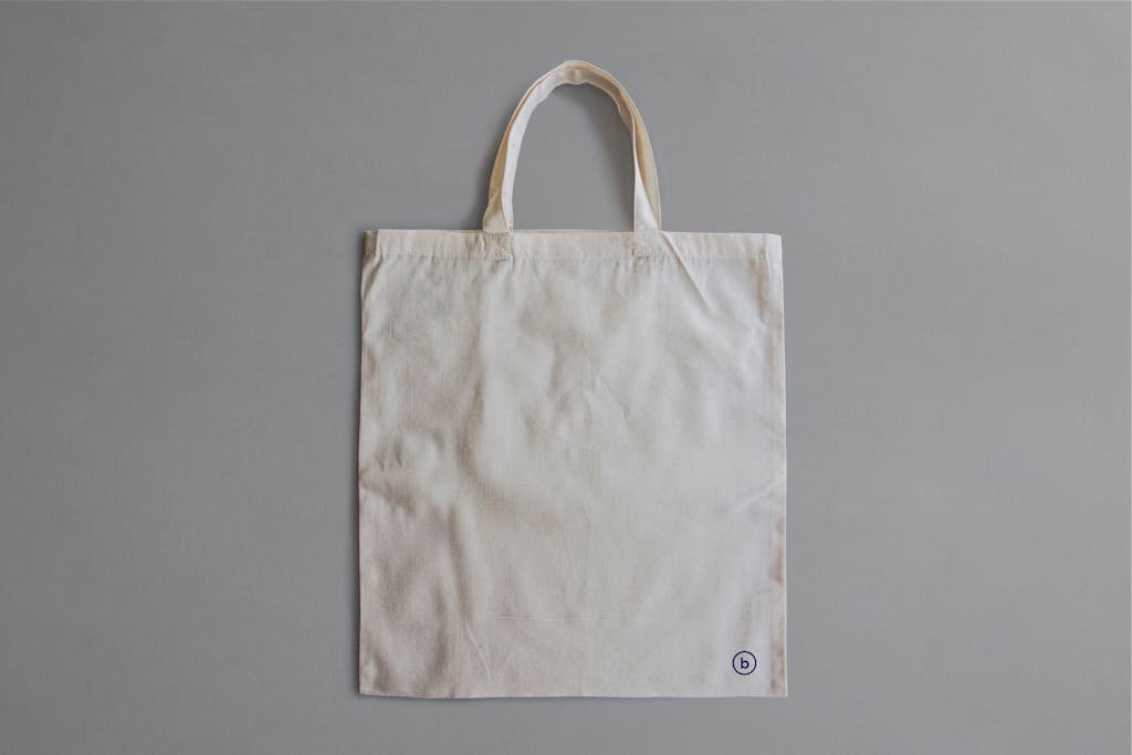 Simple blank canvas tote bag for product display or branding.