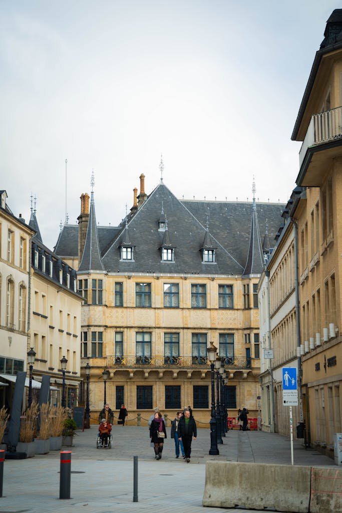 Street view of Grand-Ducal Palace with pedestrians in Luxembourg City.