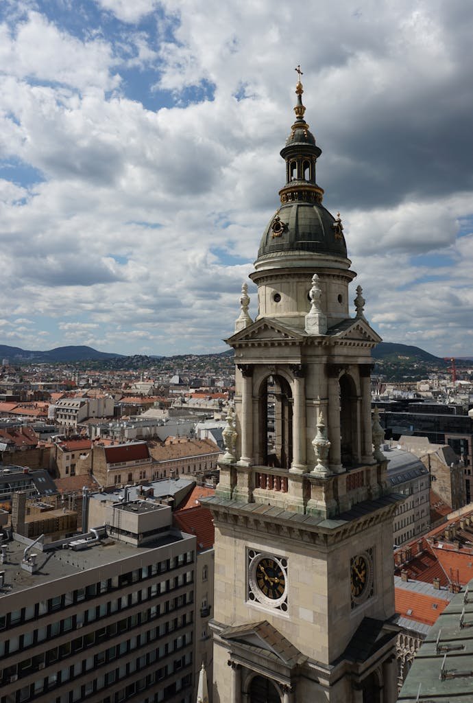20 Best Things to Do in Budapest, Hungary: An In-depth Travel Guide 5 A stunning view of St. Stephen's Basilica bell tower over Budapest with dramatic clouds.