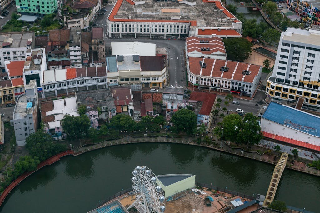Aerial shot of Malacca city showcasing historic buildings and riverfront.