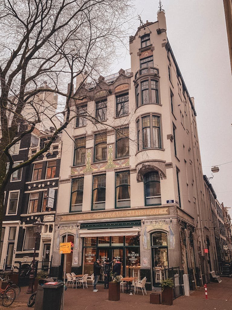 Your Complete Dutch Food Guide: What to Eat in Amsterdam and Beyond 17 Charming Amsterdam street with historic architecture captured during the day.