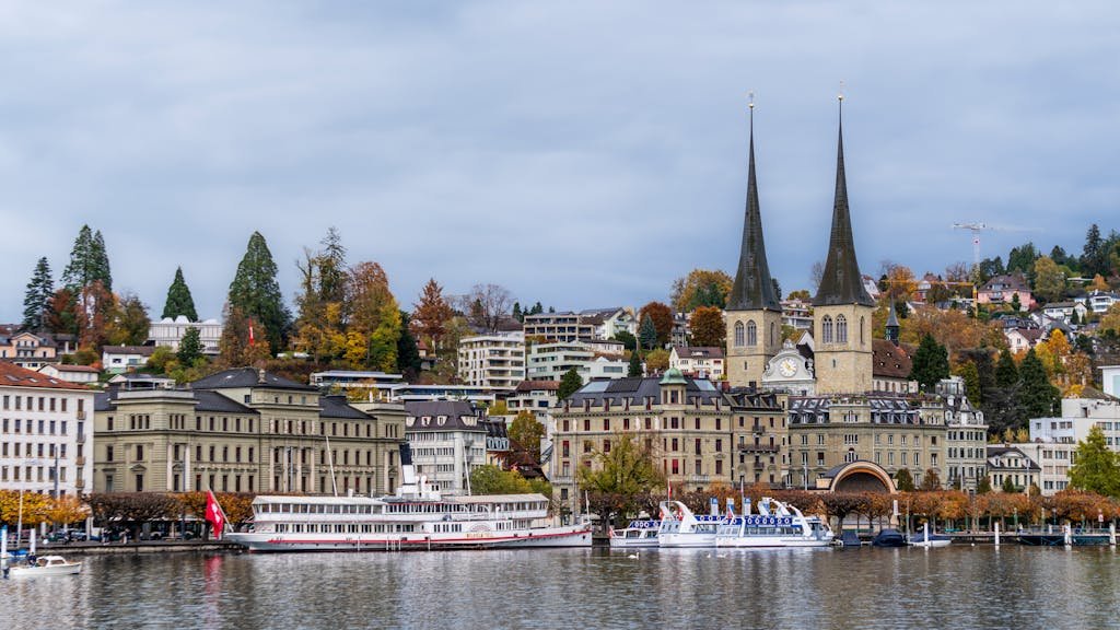 How to Spend the Perfect 5 Days in Switzerland Itinerary? 7 Charming autumn view of Lucerne, Switzerland, with iconic Chapel Bridge and waterway.