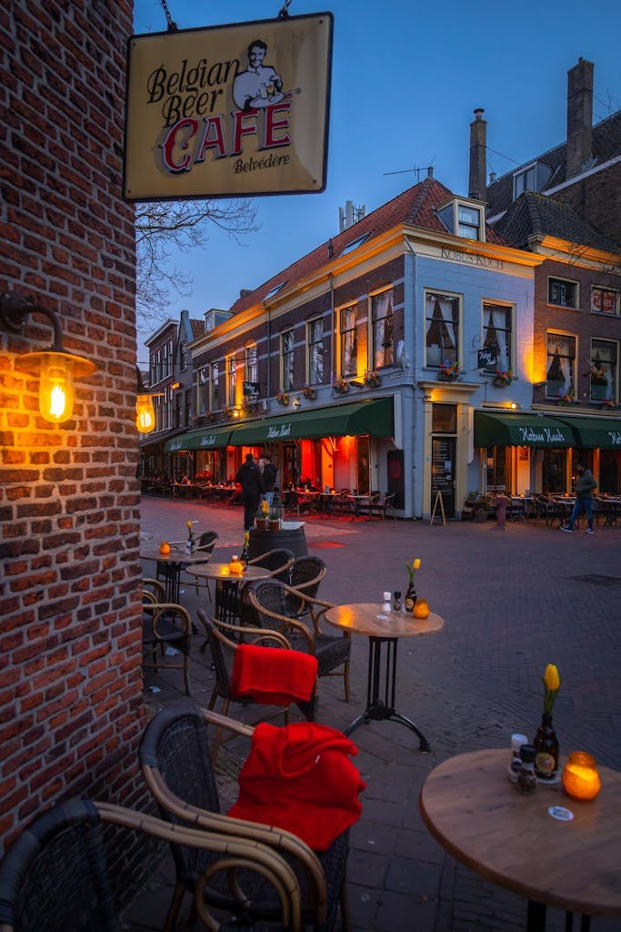 15 Best Things To Do In Brussels Belgium: Tips for first time visitors 6 Cozy street view of Belgian Beer Cafe in Delft at twilight, capturing its inviting ambiance. best things to do in Brussels Belgium