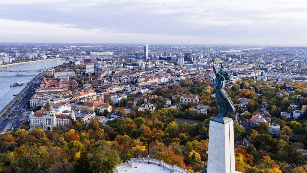 20 Best Things to Do in Budapest, Hungary: An In-depth Travel Guide 2 Stunning aerial view of Budapest with the iconic Liberty Statue overlooking the city and Danube River.