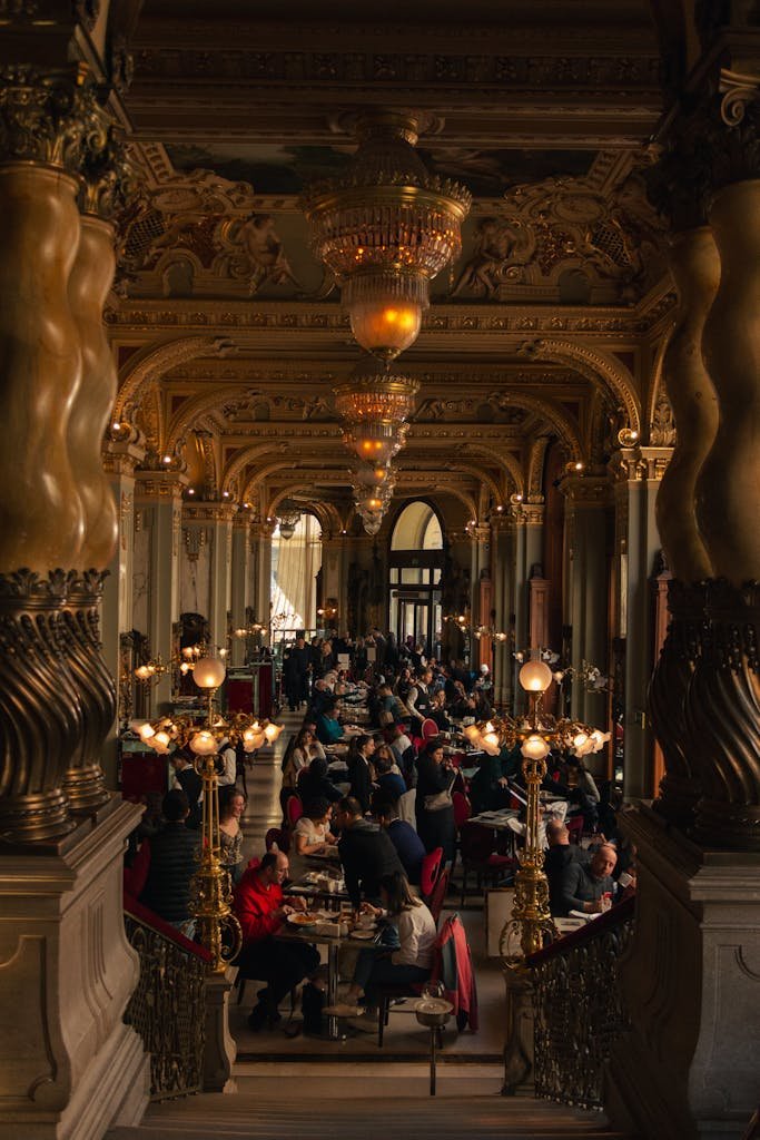 20 Best Things to Do in Budapest, Hungary: An In-depth Travel Guide 6 Stunning view of the opulent New York Cafe in Budapest featuring ornate decor and bustling patrons.