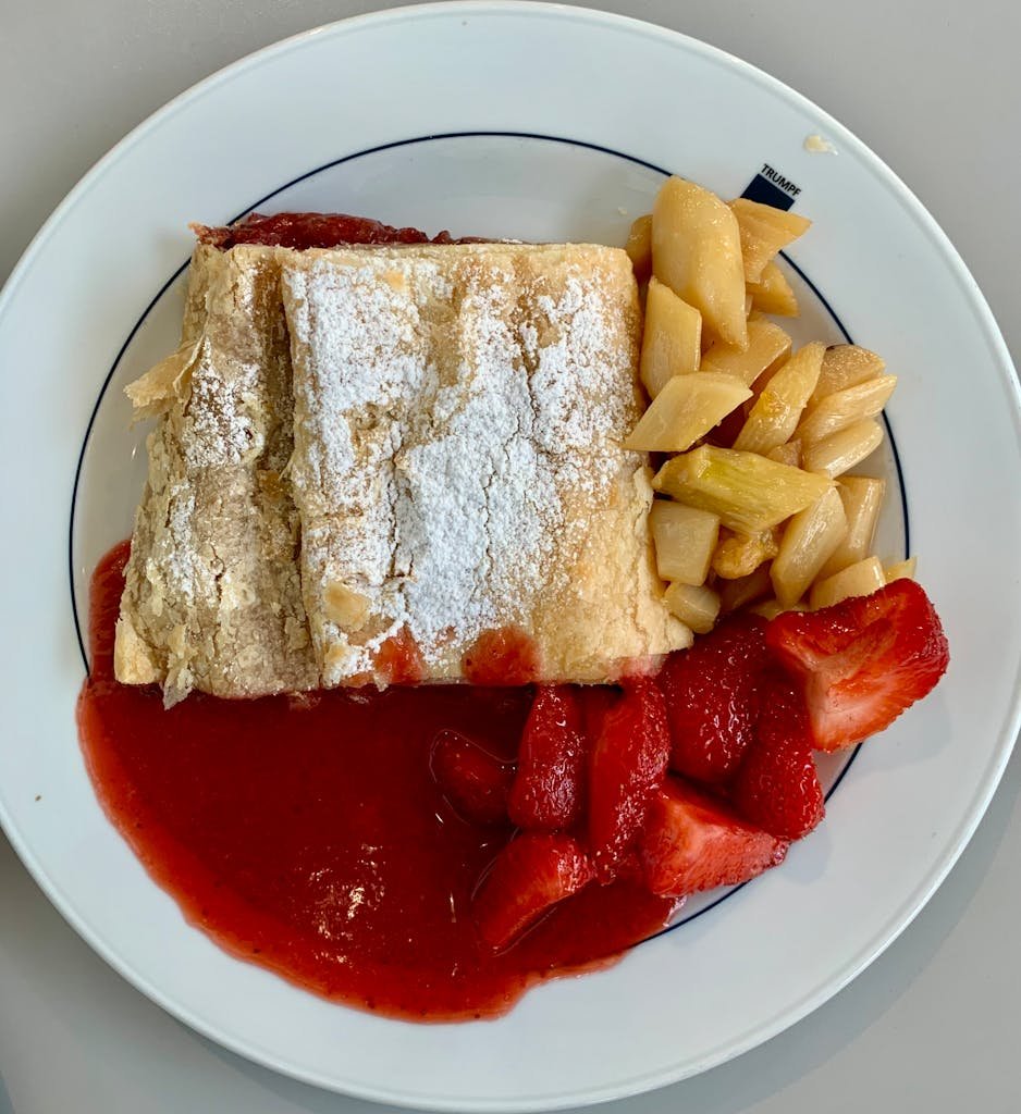 5 Days in Austria: The Perfect Austria Road Trip Itinerary 20 Tasty pastry served with strawberries and fruit compote in Pasching, Austria.