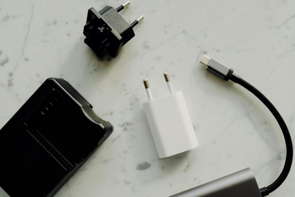 Charger, power bank, adapter and a cable on a white background table