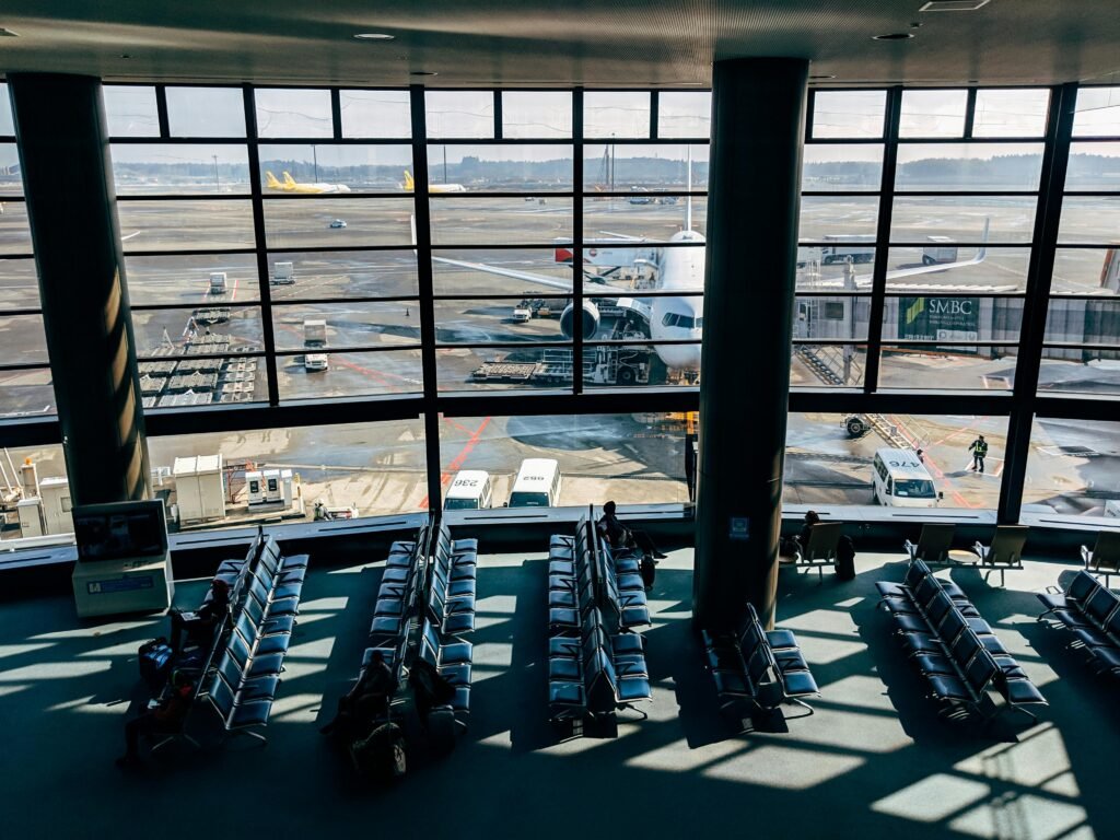 airport lounge with view of a plane through a large window