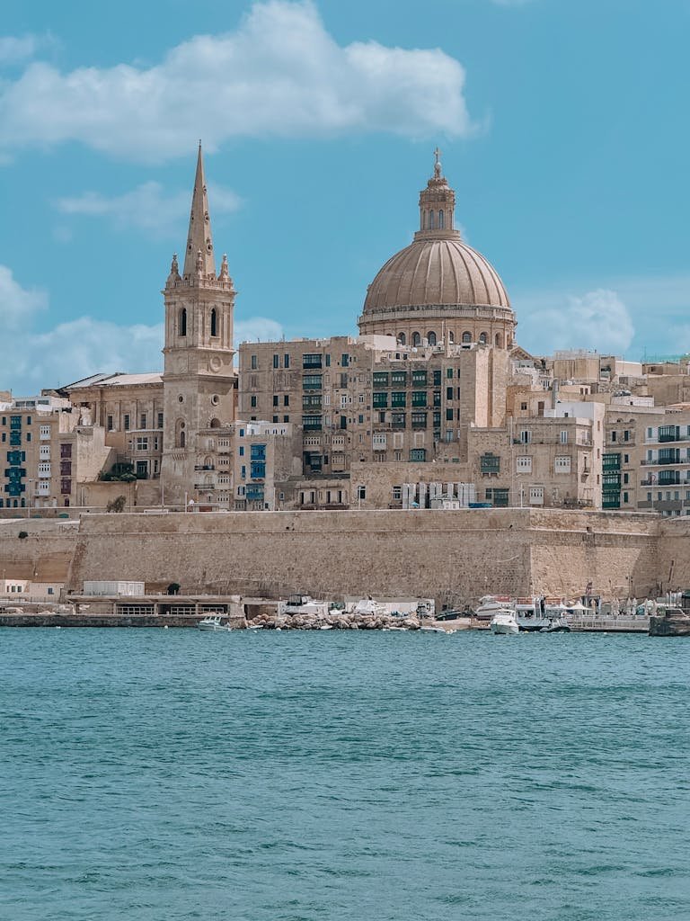Beautiful daytime view of Valletta with iconic architecture and waterfront.