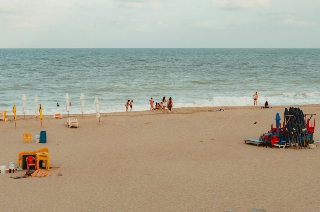 People sitting on a beautiful blue and torquoize beech