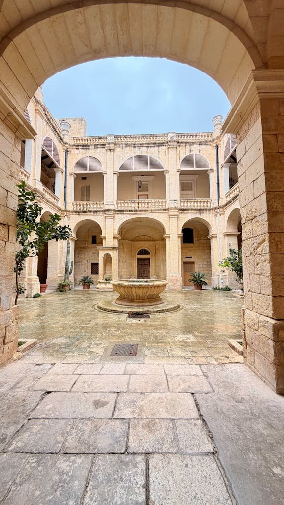 21 Best things to do in Mdina, Malta's Silent City 13 Charming historic courtyard in Mdina, Malta, featuring elegant arches and a central fountain.