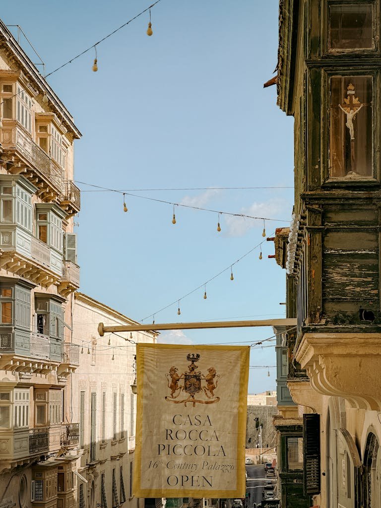 Charming street scene in Valletta, Malta featuring historic architecture and Casa Rocca Piccola.