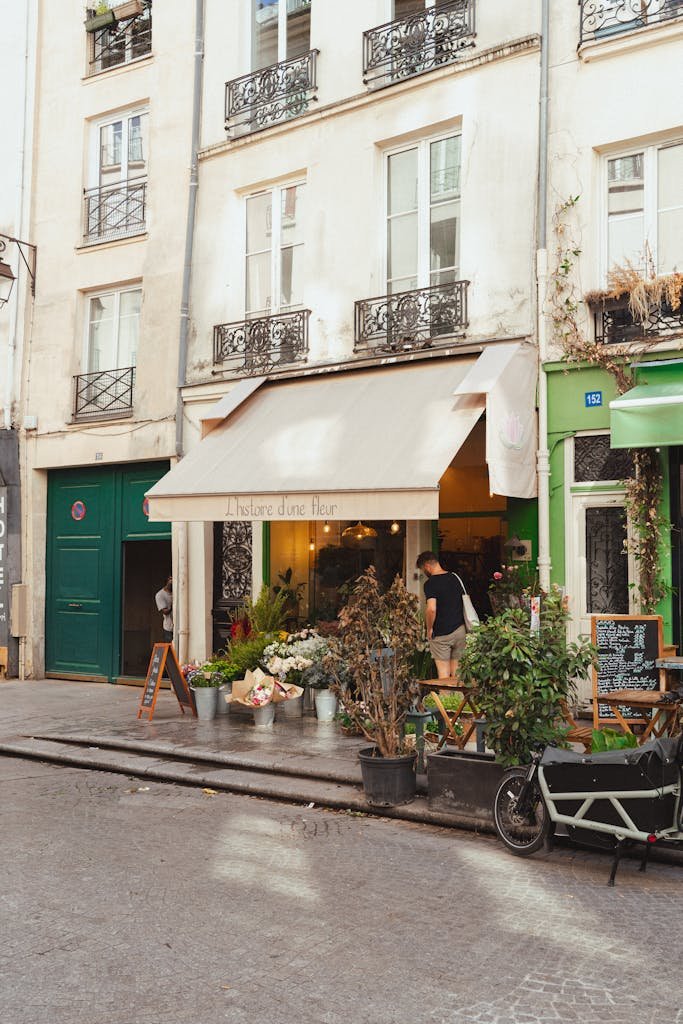 41 best Things to Do in Paris: Iconic Sights to Hidden Gems 16 Cozy café with flowers in Le Marais, Paris. Perfect for a leisurely urban stroll.