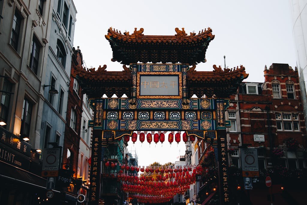 Discover London's vibrant Chinatown with its iconic ornate gate and cultural decor.