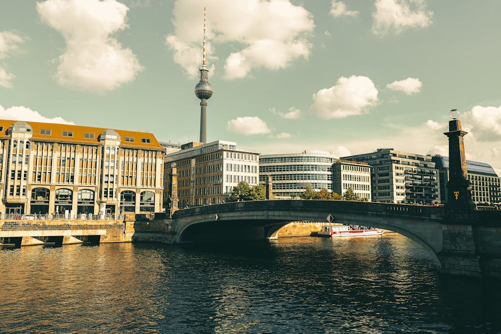 Explore Berlin's stunning architecture and iconic TV Tower from a riverside view.