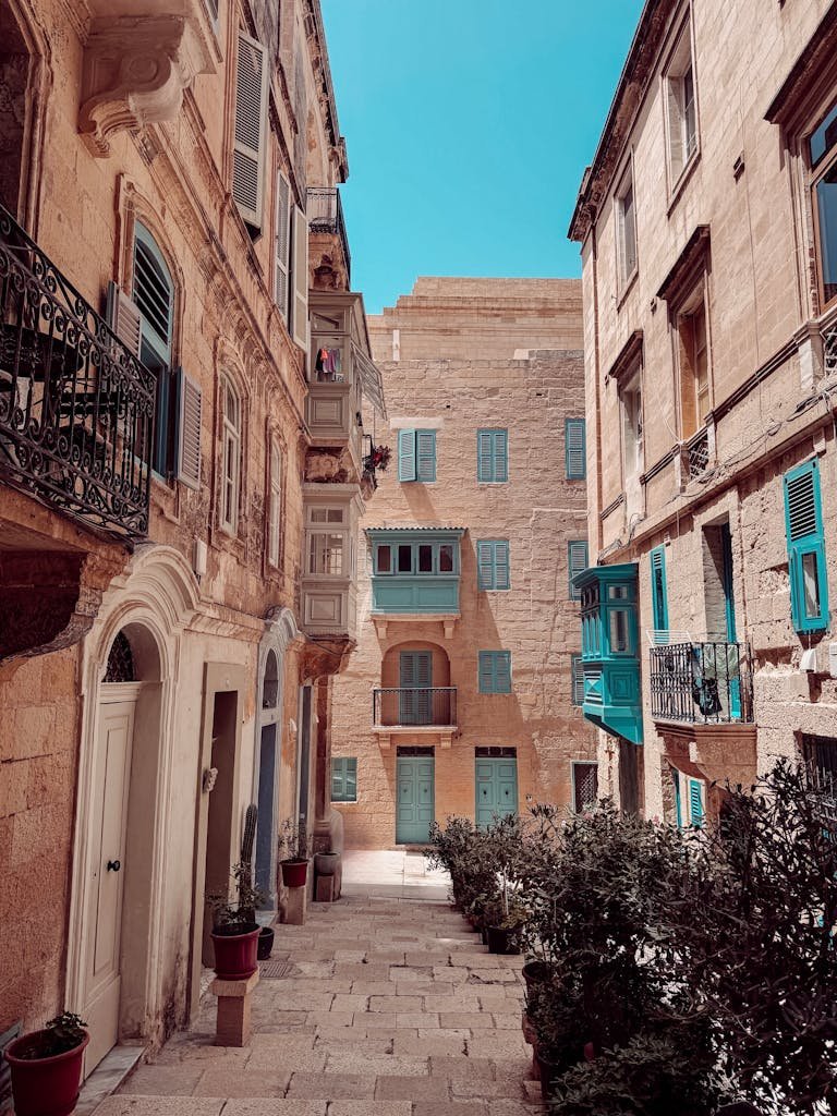 Explore the captivating charm of Valletta's streets featuring vibrant maltese balconies.