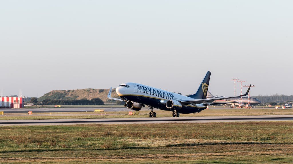 Ryanair jet landing on a sunny day at Prague Airport, Czech Republic.