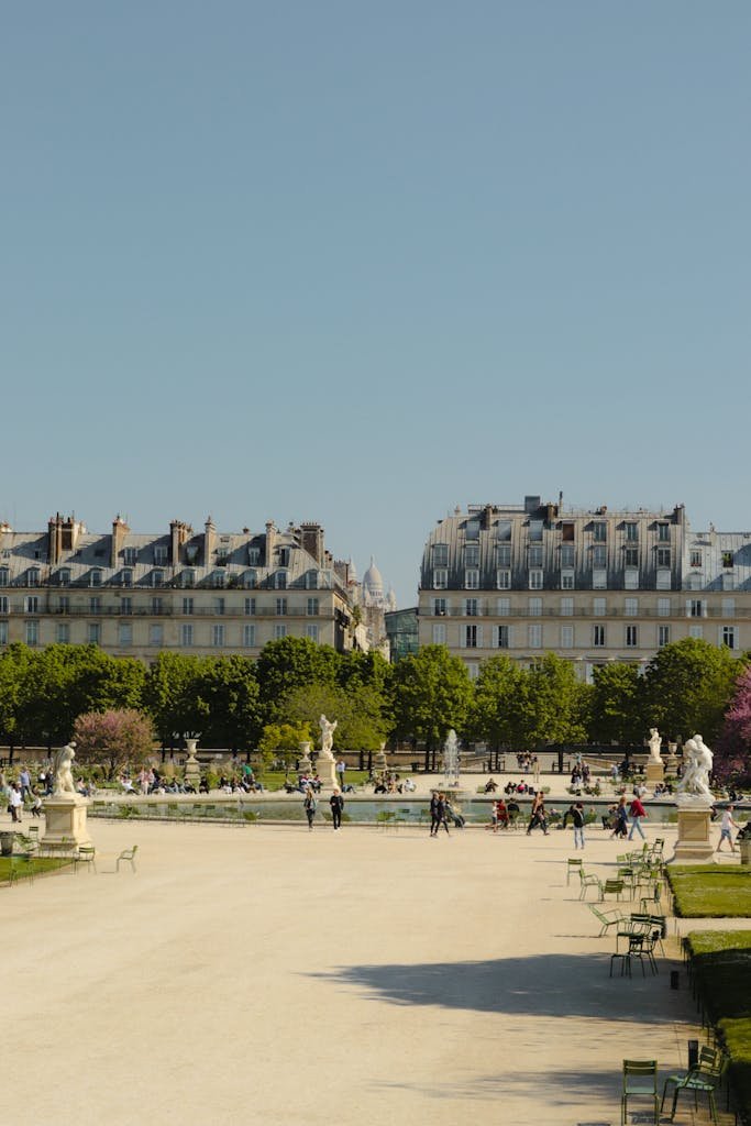 41 best Things to Do in Paris: Iconic Sights to Hidden Gems 6 Scenic view of people enjoying a sunny day in the historic Jardins des Tuileries, Paris.