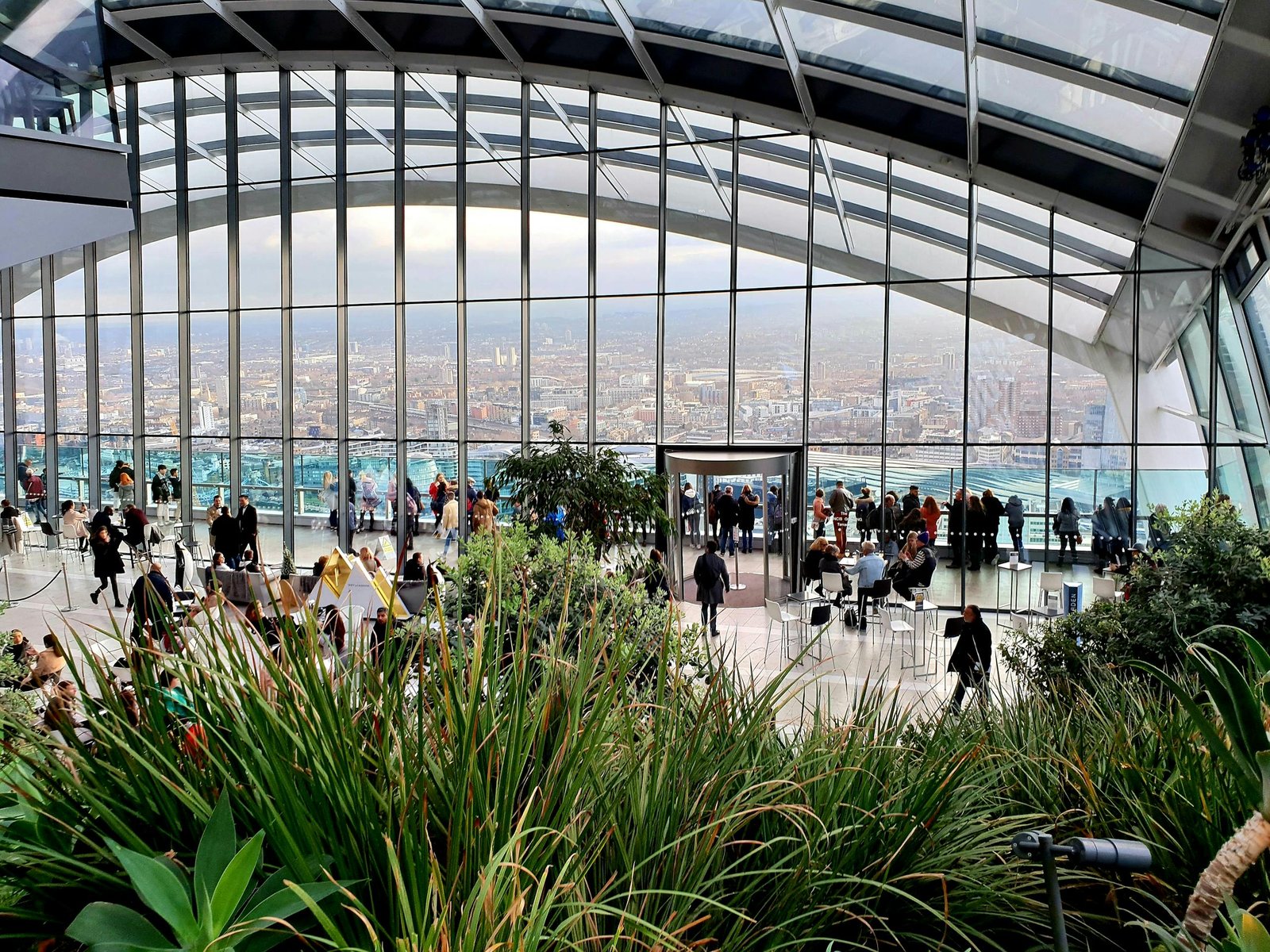 Stunning view of London from the Sky Garden with lush greenery and urban backdrop.