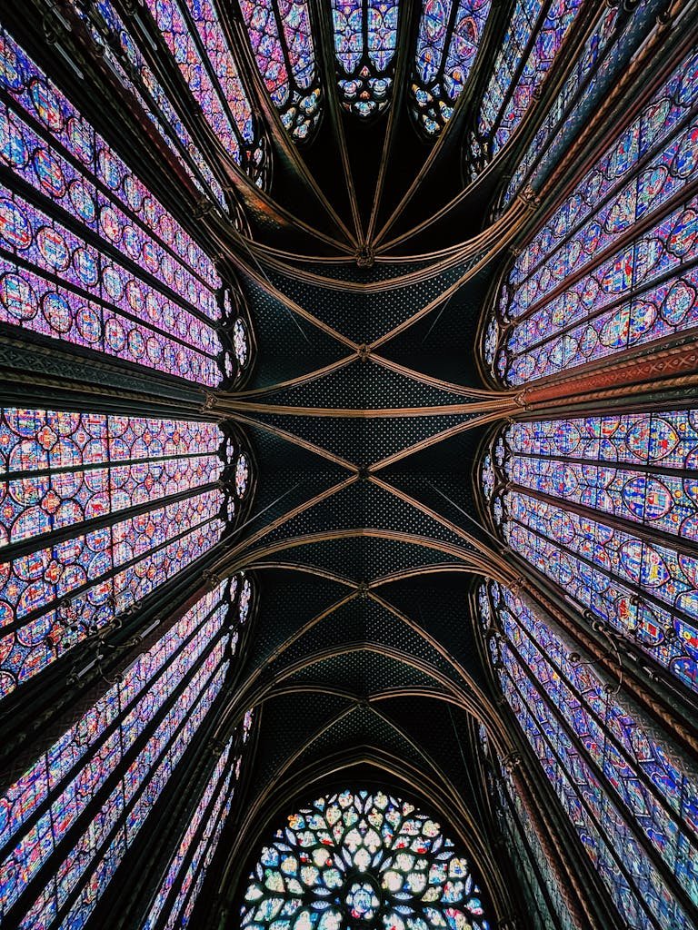 41 best Things to Do in Paris: Iconic Sights to Hidden Gems 7 Stunning view of the intricate stained glass windows in Paris' Sainte-Chapelle.