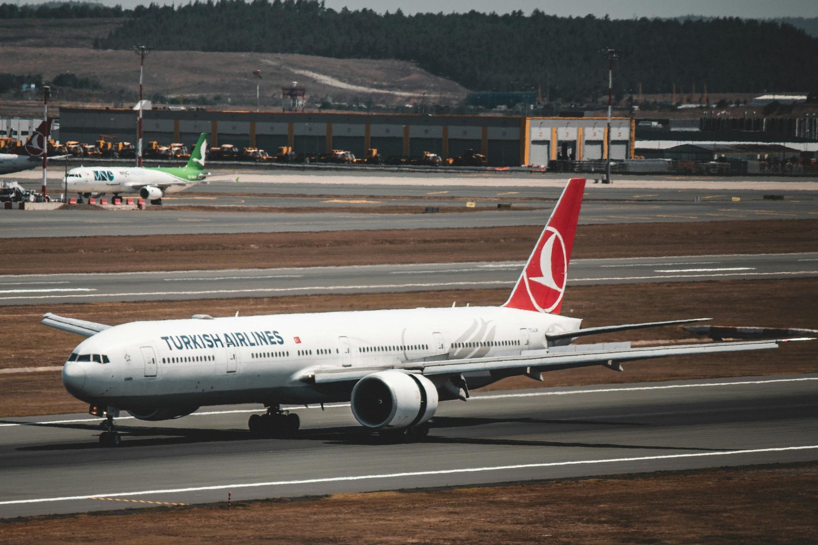 Turkish Airlines aircraft taxiing at Istanbul Airport in Türkiye, showcasing aviation travel.