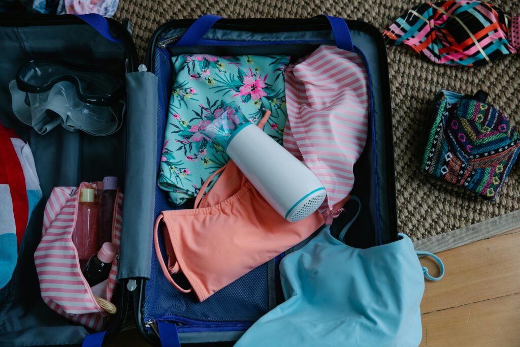 undergarments and colorful clothes in a suitcase