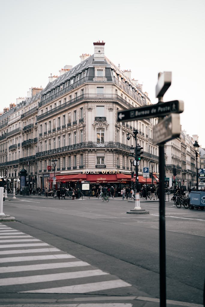 41 best Things to Do in Paris: Iconic Sights to Hidden Gems 29 Vibrant street view of central Paris filled with people and traffic on a summer day.