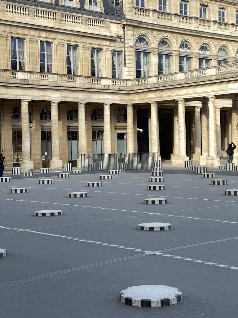 41 best Things to Do in Paris: Iconic Sights to Hidden Gems 5 View of Buren's Columns in the historic Palais Royal courtyard, Paris.