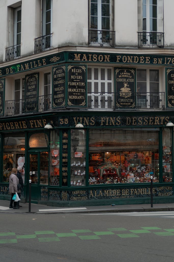 41 best Things to Do in Paris: Iconic Sights to Hidden Gems 26 Vintage chocolate shop facade in Paris, showcasing elegant architecture and signage.